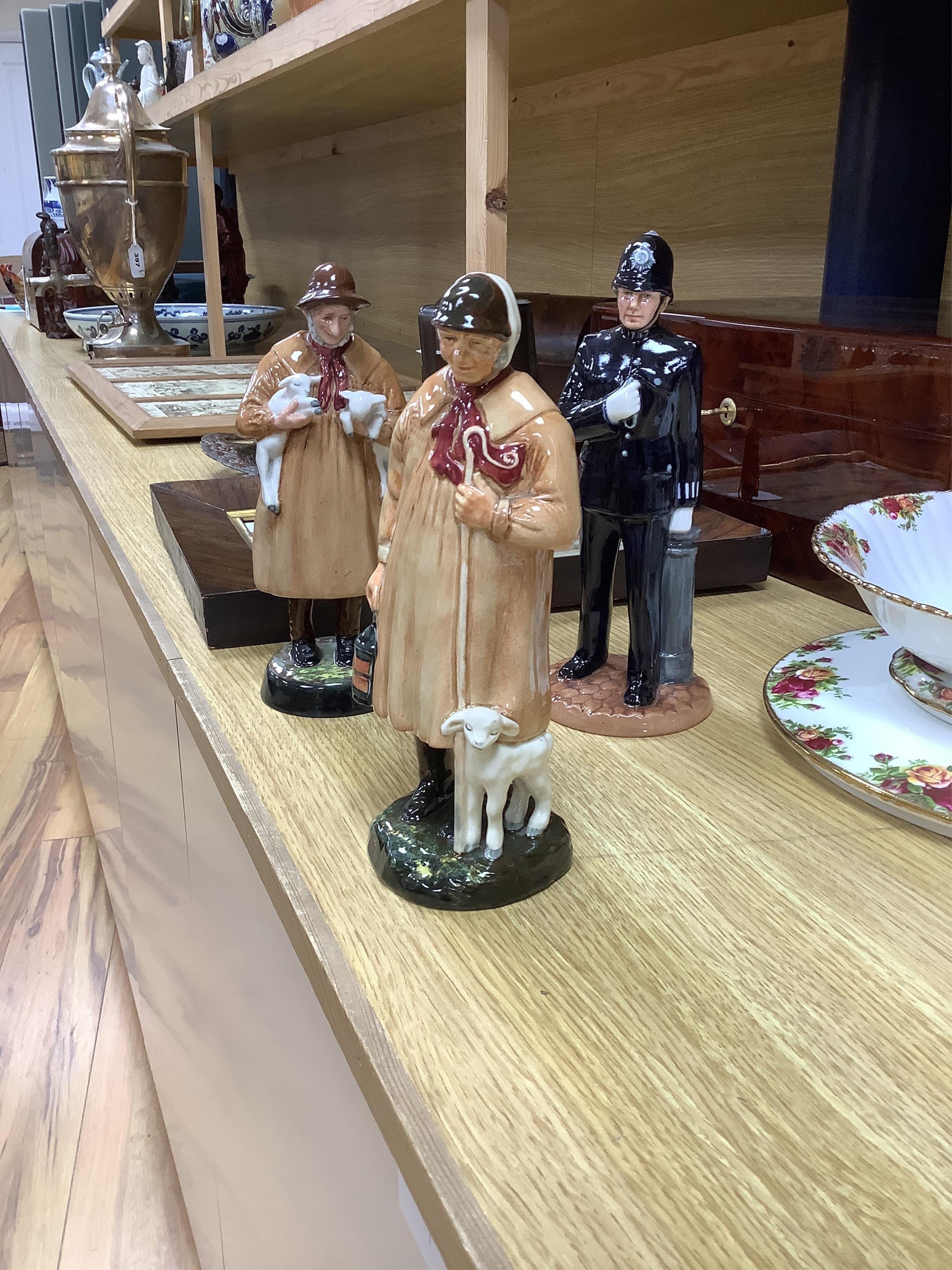 A collection of Royal Doulton figures to include The Old Balloon Seller, Doctor, Votes for Women and The Detective